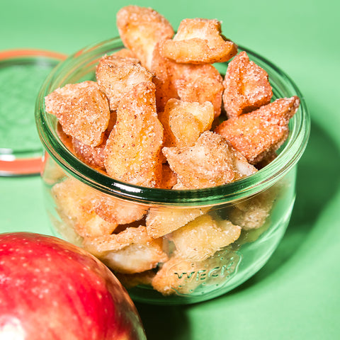 Apple pieces coated with cinnamon and sugar